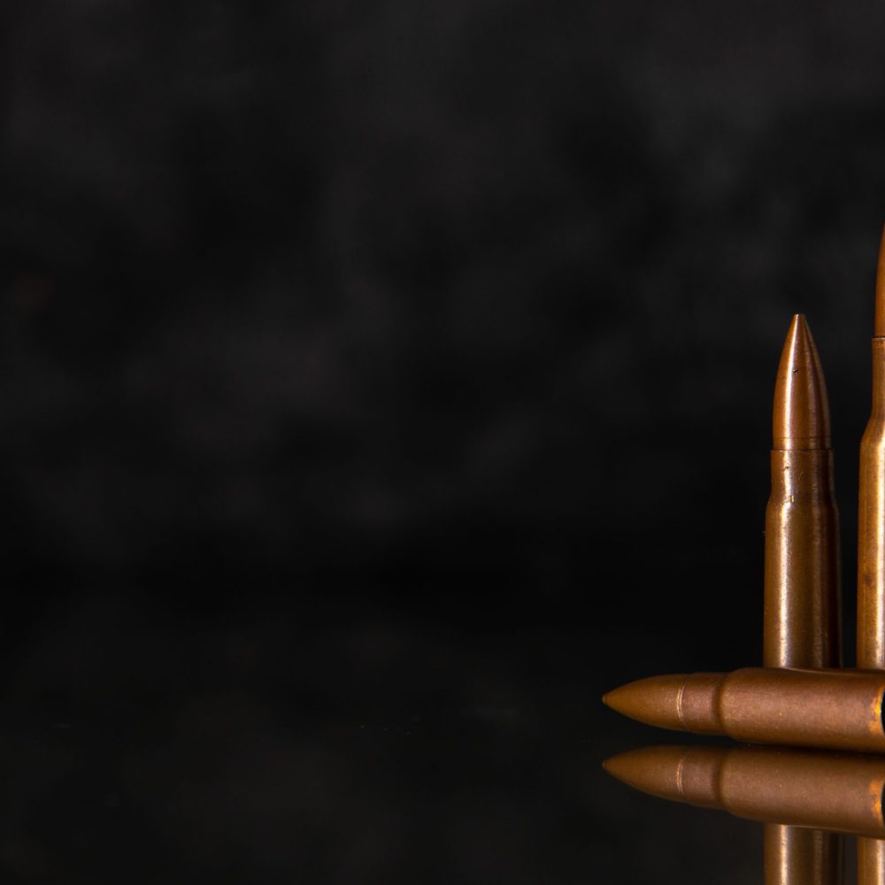 brown-bullets-on-a-dark-background-shooting-gun-ta-2026-01-07-23-21-20-utc
